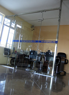 Office panel with spider glazing system